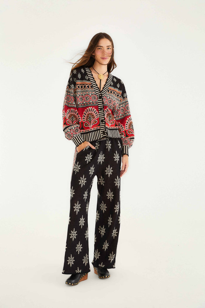 FARM Rio model wearing the Black Ainika Love Coconut Groove Knit Cardigan