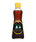 A bottle of Kadoya Roasted Sesame Oil 100% Pure with a yellow cap on a white background.